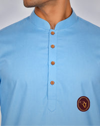 Close-up of men's light blue cotton kurta neckline and button placket
